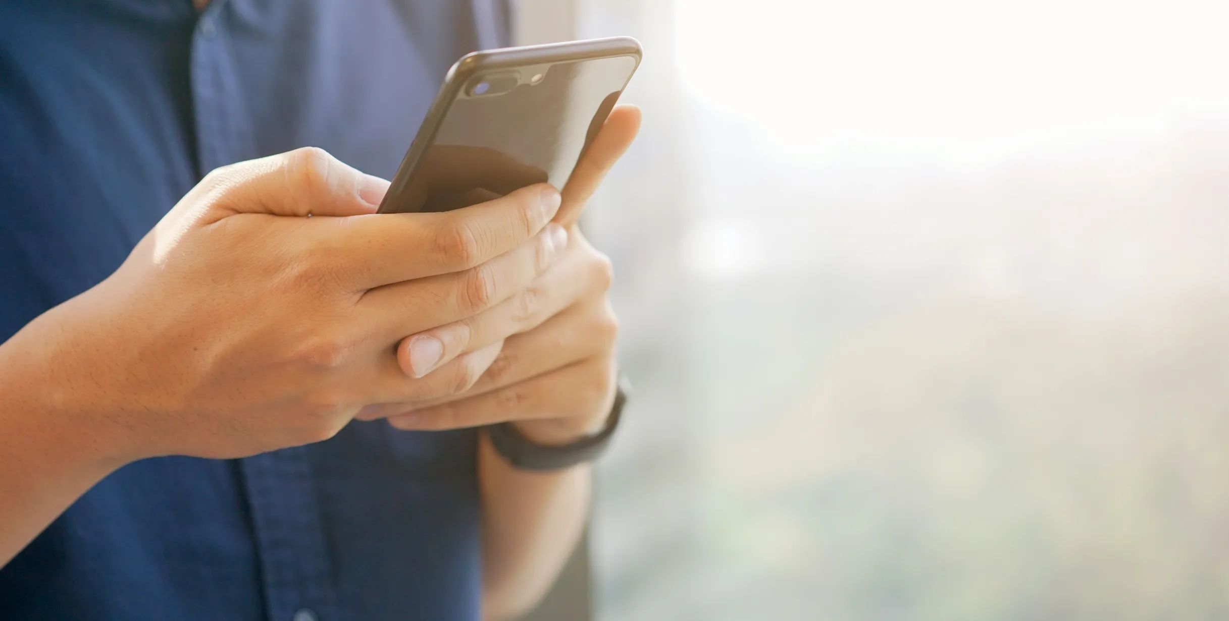 A person using a mobile phone